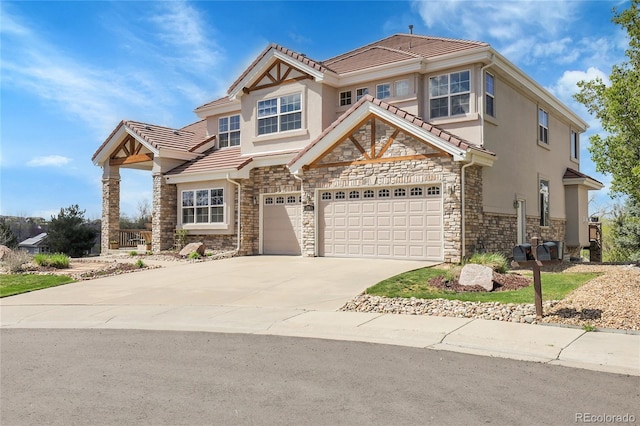 23965 E Kettle Pl, Aurora, CO 80016 - view of front of property with stone siding, a tiled roof, and driveway