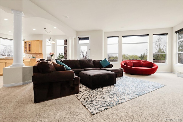 23965 E Kettle Pl, Aurora, CO 80016 - living room featuring ornate columns, light carpet, and recessed lighting