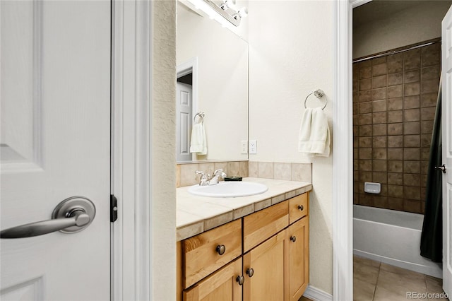 23965 E Kettle Pl, Aurora, CO 80016 - bathroom featuring tile patterned flooring, vanity, and  shower combination