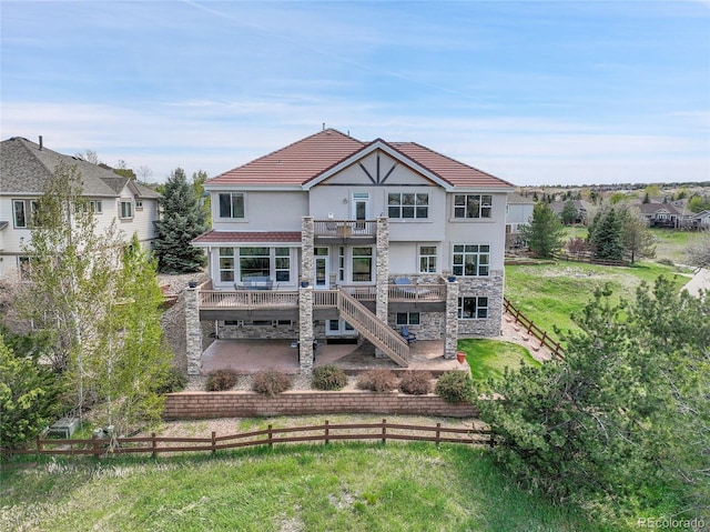 23965 E Kettle Pl, Aurora, CO 80016 - rear view of house with a balcony, a patio area, stone siding, stairway, and a deck