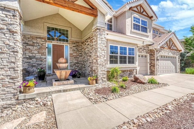 23965 E Kettle Pl, Aurora, CO 80016 - doorway to property featuring stone siding, stucco siding, and concrete driveway