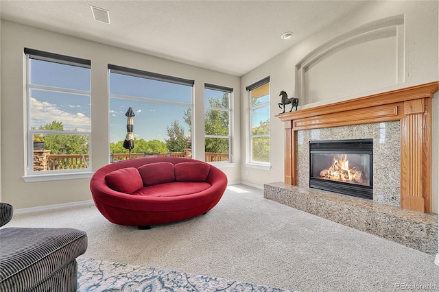 23965 E Kettle Pl, Aurora, CO 80016 - carpeted living room featuring a fireplace and healthy amount of natural light
