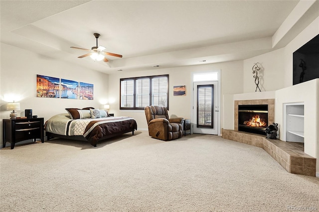 23965 E Kettle Pl, Aurora, CO 80016 - carpeted bedroom with a raised ceiling, a fireplace, and ceiling fan
