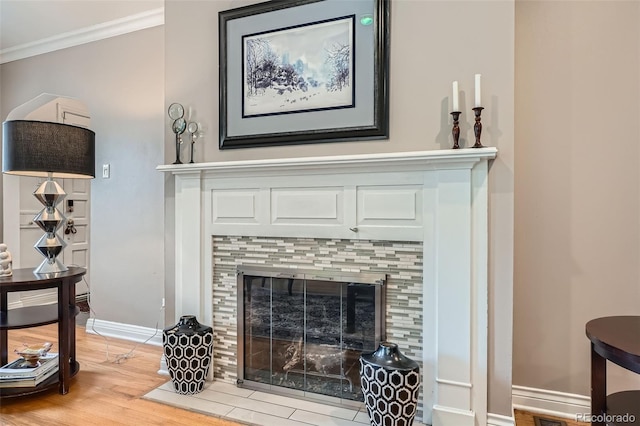 824 S Medea Way, Denver, CO 80209 - detailed view of a fireplace, wood finished floors, ornamental molding, and baseboards