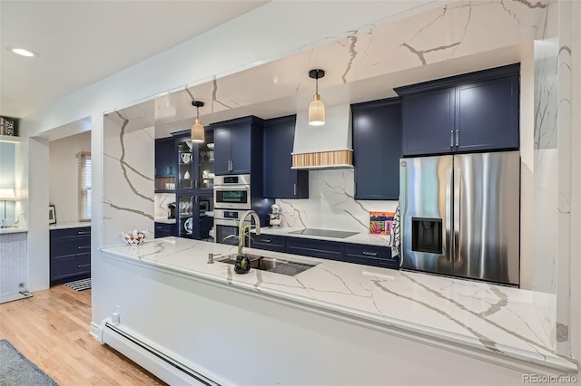 824 S Medea Way, Denver, CO 80209 - kitchen featuring stainless steel appliances, blue cabinetry, a sink, light stone counters, and recessed lighting