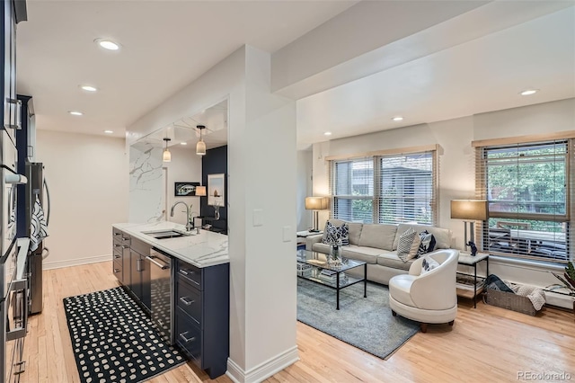 824 S Medea Way, Denver, CO 80209 - living room with light wood-type flooring, recessed lighting, and baseboards