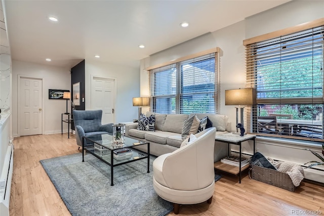 824 S Medea Way, Denver, CO 80209 - living room with light wood-style floors, healthy amount of natural light, recessed lighting, and a baseboard radiator