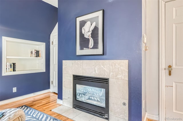 824 S Medea Way, Denver, CO 80209 - living room featuring wood finished floors, a fireplace, and baseboards