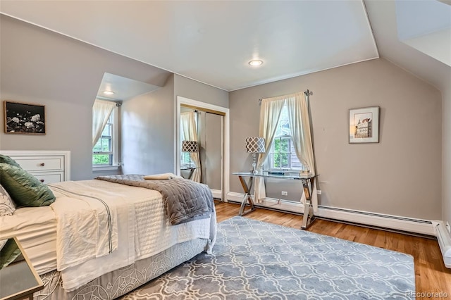 824 S Medea Way, Denver, CO 80209 - bedroom featuring multiple windows, vaulted ceiling, a closet, wood finished floors, and baseboards