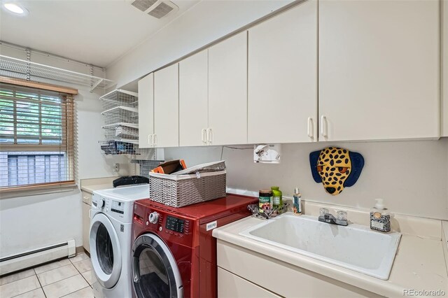 824 S Medea Way, Denver, CO 80209 - washroom with a baseboard heating unit, cabinet space, washing machine and clothes dryer, and light tile patterned floors