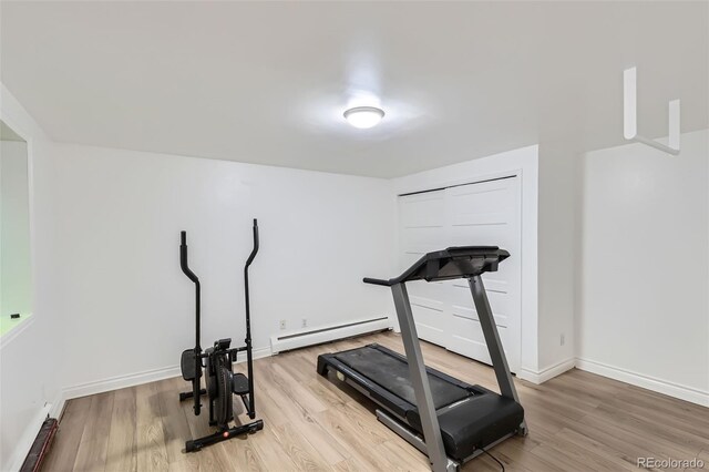 824 S Medea Way, Denver, CO 80209 - workout area featuring a baseboard heating unit and wood finished floors