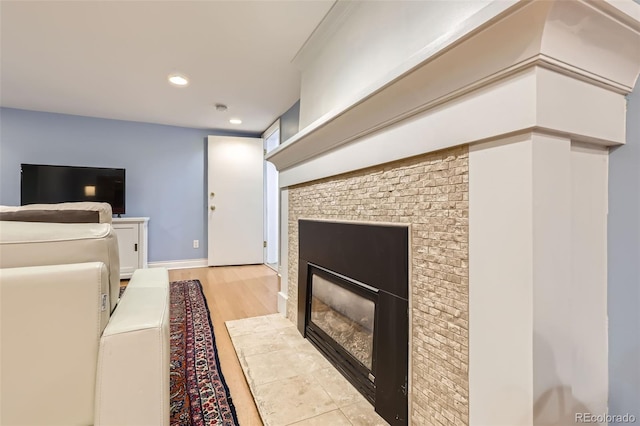 824 S Medea Way, Denver, CO 80209 - living area featuring light wood-style flooring, a tile fireplace, and recessed lighting