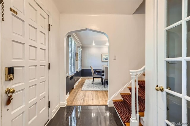 824 S Medea Way, Denver, CO 80209 - foyer entrance with arched walkways, ornamental molding, and granite floors