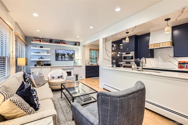 824 S Medea Way, Denver, CO 80209 - living area with a baseboard heating unit, light wood-type flooring, and recessed lighting