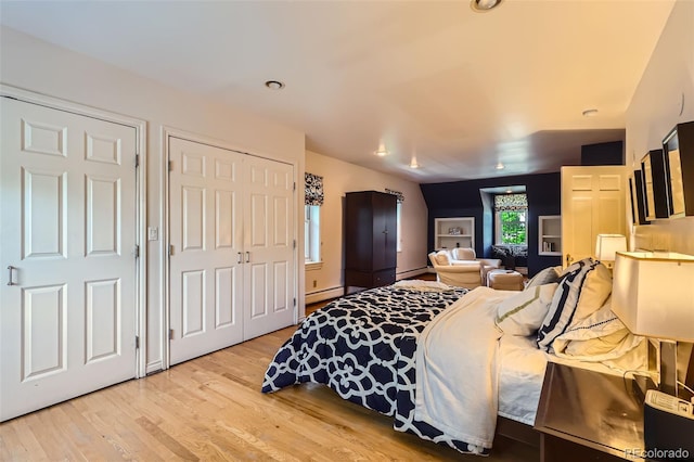824 S Medea Way, Denver, CO 80209 - bedroom featuring light wood-style floors and a baseboard heating unit