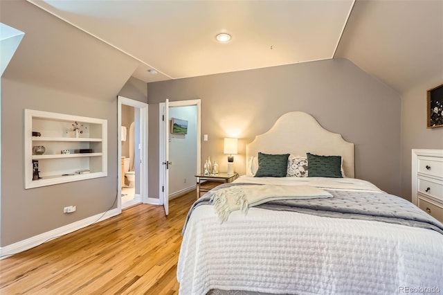 824 S Medea Way, Denver, CO 80209 - bedroom featuring lofted ceiling, light wood finished floors, and ensuite bathroom