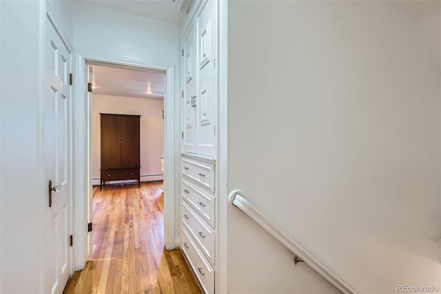 824 S Medea Way, Denver, CO 80209 - corridor with light wood finished floors and a baseboard radiator