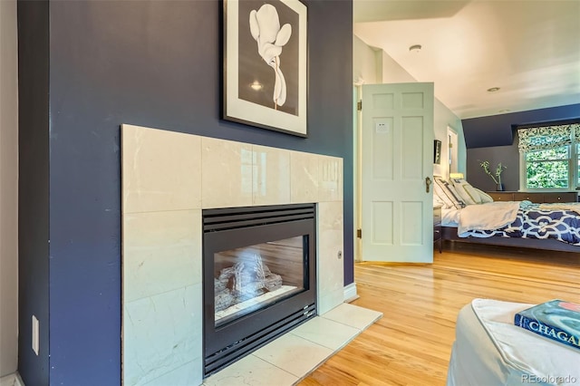 824 S Medea Way, Denver, CO 80209 - bedroom featuring wood finished floors and a fireplace