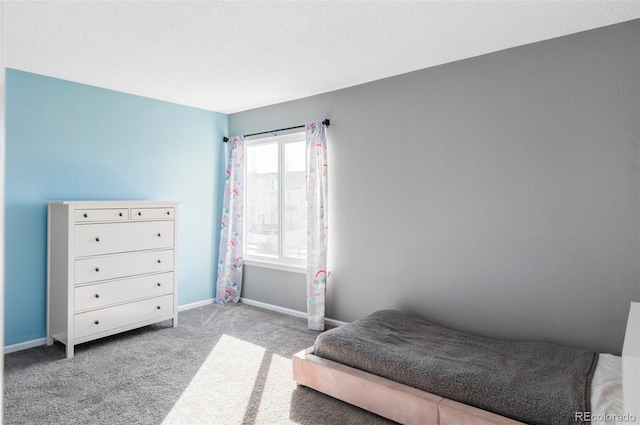 carpeted bedroom with a textured ceiling