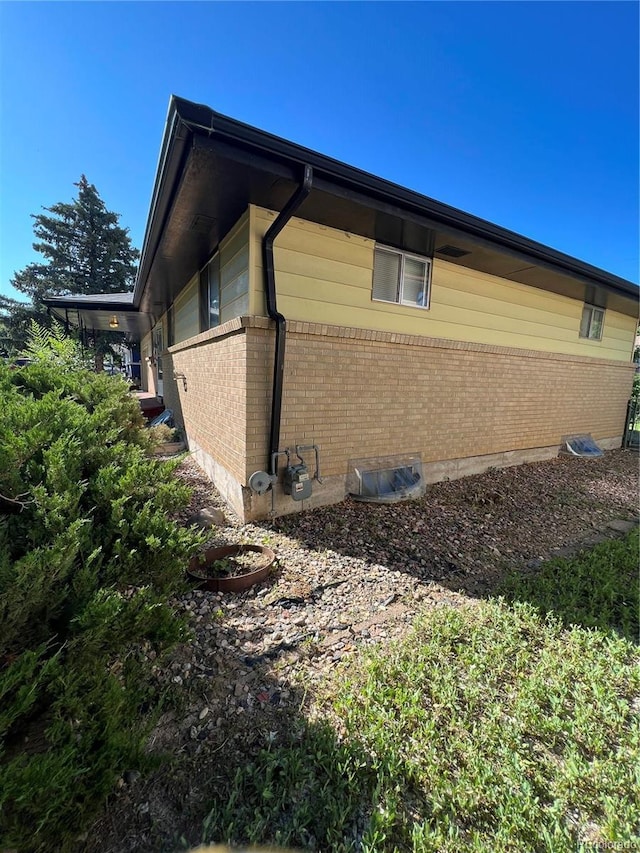 11812 E Alaska Ave, Aurora, CO 80012 - view of property exterior featuring brick siding