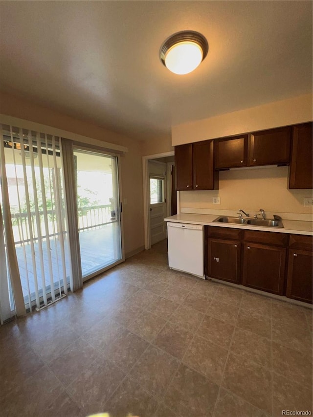 11812 E Alaska Ave, Aurora, CO 80012 - kitchen with dark brown cabinetry, white dishwasher, and light countertops