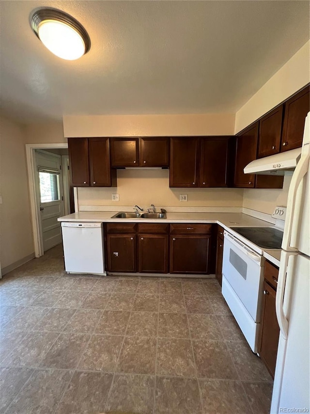 11812 E Alaska Ave, Aurora, CO 80012 - kitchen with white appliances, dark brown cabinets, under cabinet range hood, and light countertops