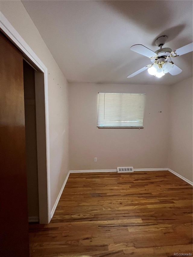11812 E Alaska Ave, Aurora, CO 80012 - spare room featuring wood finished floors and ceiling fan