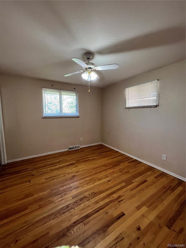 11812 E Alaska Ave, Aurora, CO 80012 - spare room with ceiling fan and wood finished floors