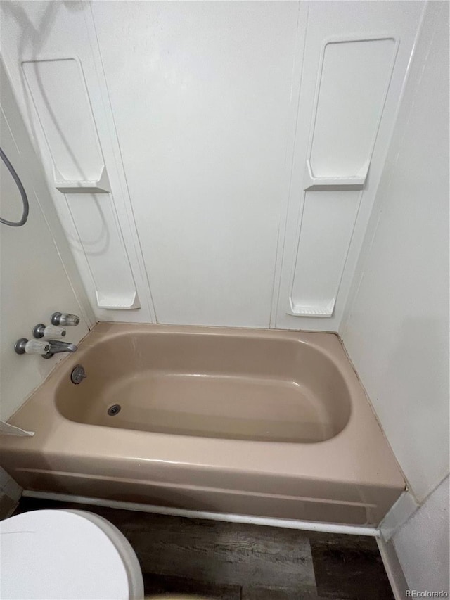 11812 E Alaska Ave, Aurora, CO 80012 - full bathroom featuring toilet and shower / washtub combination