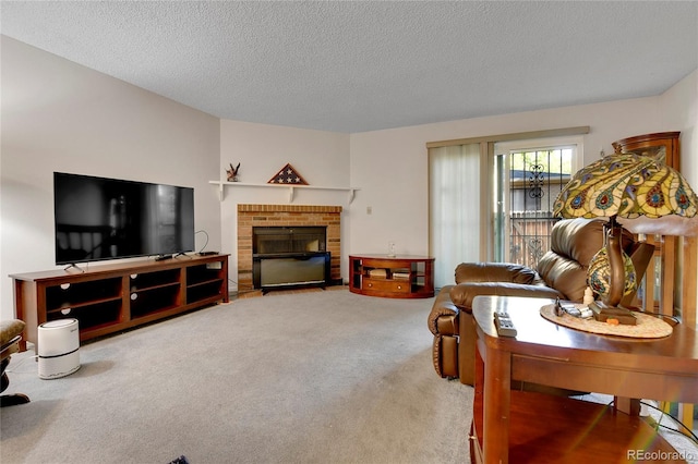 carpeted living room with a brick fireplace and a textured ceiling