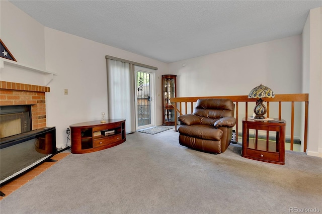 living area featuring light colored carpet, a brick fireplace, and a textured ceiling