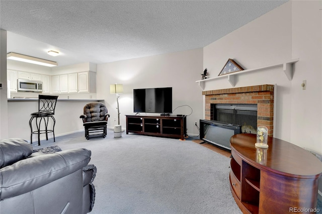 living room with light carpet, a brick fireplace, and a textured ceiling