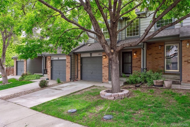 1953 E 102nd Cir, Thornton, CO 80229 - view of front facade with brick siding, concrete driveway, roof with shingles, and an attached garage
