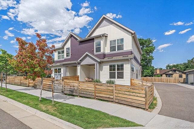 6106 W 28th Ct, Edgewater, CO 80214 - view of front of house featuring a fenced front yard and board and batten siding