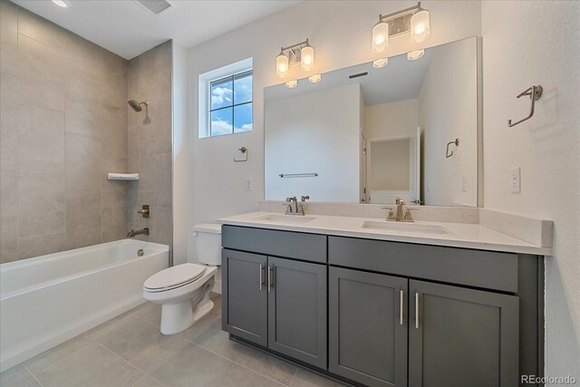 6106 W 28th Ct, Edgewater, CO 80214 - bathroom with double vanity, tub / shower combination, and tile patterned flooring
