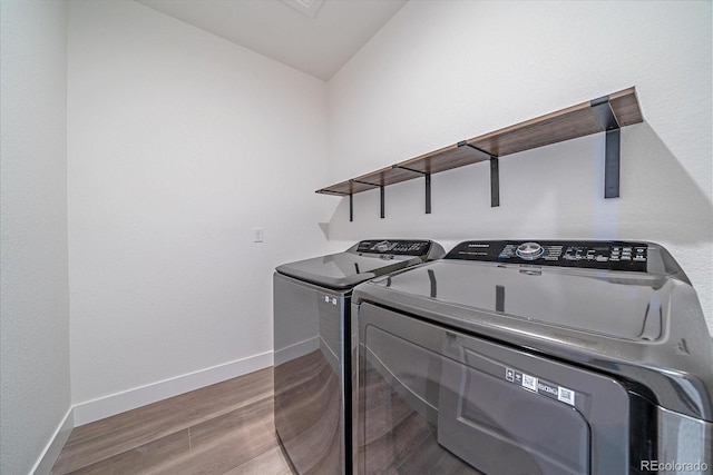 6106 W 28th Ct, Edgewater, CO 80214 - laundry room featuring washer and dryer and wood finished floors