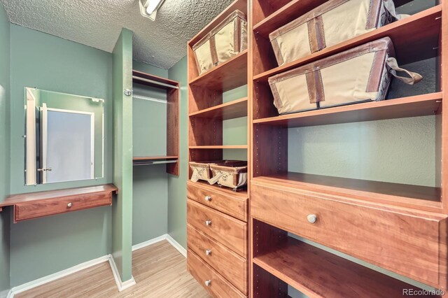 1020 15th St Unit 20F, Denver, CO 80202 - walk in closet with wood finished floors