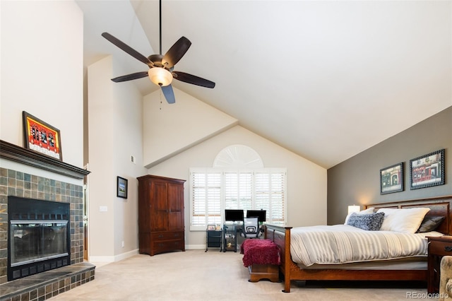 carpeted bedroom with baseboards, a tile fireplace, ceiling fan, access to exterior, and vaulted ceiling