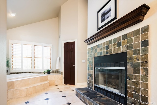 bathroom featuring high vaulted ceiling, tile patterned flooring, a fireplace, and a bath