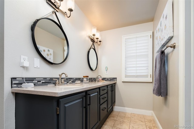 bathroom featuring baseboards, a sink, decorative backsplash, and double vanity