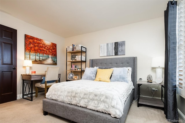 bedroom featuring carpet floors and baseboards