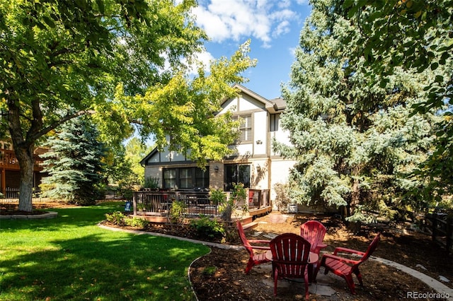 view of yard with a wooden deck