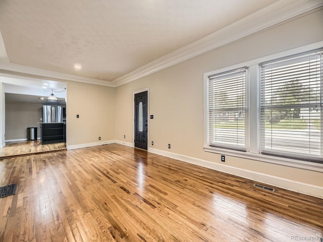 5339 S Windermere St, Littleton, CO 80120 - unfurnished living room with ornamental molding, light wood-type flooring, and baseboards
