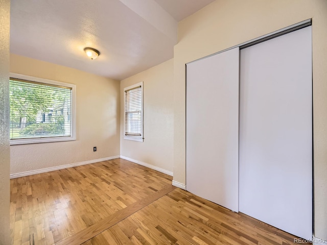5339 S Windermere St, Littleton, CO 80120 - unfurnished bedroom with wood finished floors, baseboards, and a closet