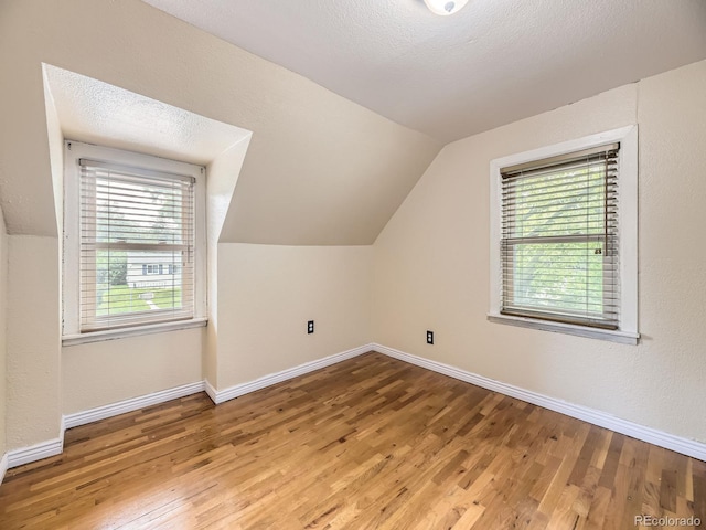 5339 S Windermere St, Littleton, CO 80120 - bonus room featuring lofted ceiling, plenty of natural light, wood finished floors, and baseboards