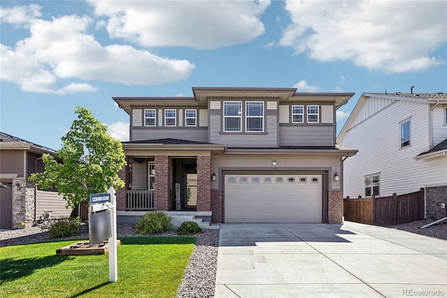 1846 Osprey Dr, Brighton, CO 80601 - prairie-style house featuring brick siding, a garage, driveway, and a porch