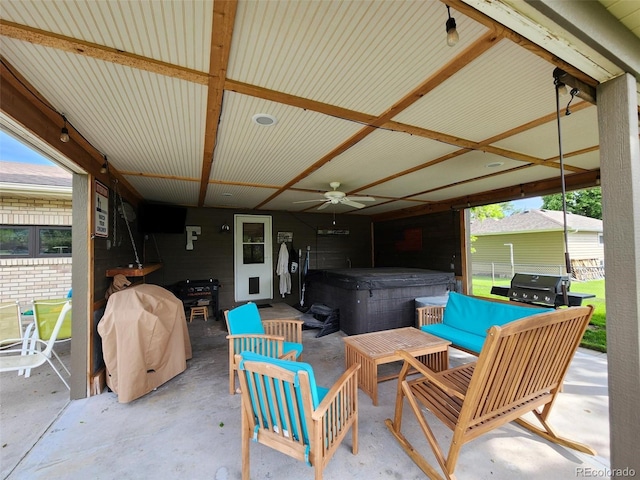 view of patio / terrace with a hot tub, outdoor lounge area, a ceiling fan, and a grill