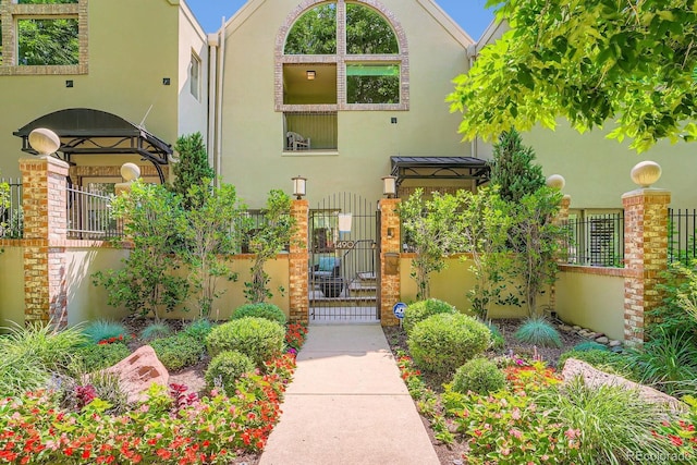 490 Columbine St Unit 5, Denver, CO 80206 - property entrance featuring stucco siding and a gate