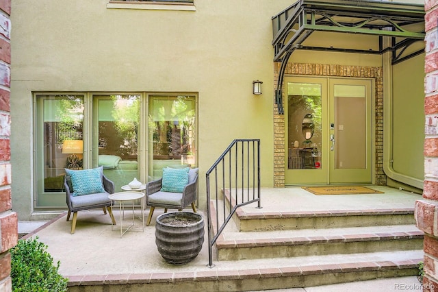490 Columbine St Unit 5, Denver, CO 80206 - view of exterior entry featuring stucco siding and french doors