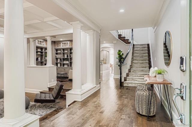 490 Columbine St Unit 5, Denver, CO 80206 - entrance foyer featuring decorative columns, crown molding, wood finished floors, stairway, and recessed lighting